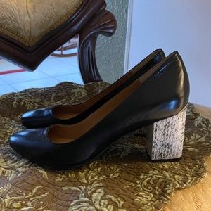 NWOT. Calvin Klein Black almond-toe pump with faux snake-skin block heel.